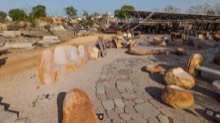 Display yard with freestanding stone products and circular paving layout