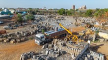 Loading activity among stone blocks in the working yard