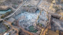 Evening aerial of the quarry floor and cut walls