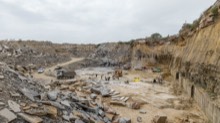 Open quarry bay with cut slabs laid out for lifting