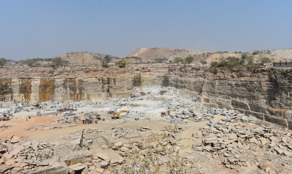 Wide quarry view with layered rock walls