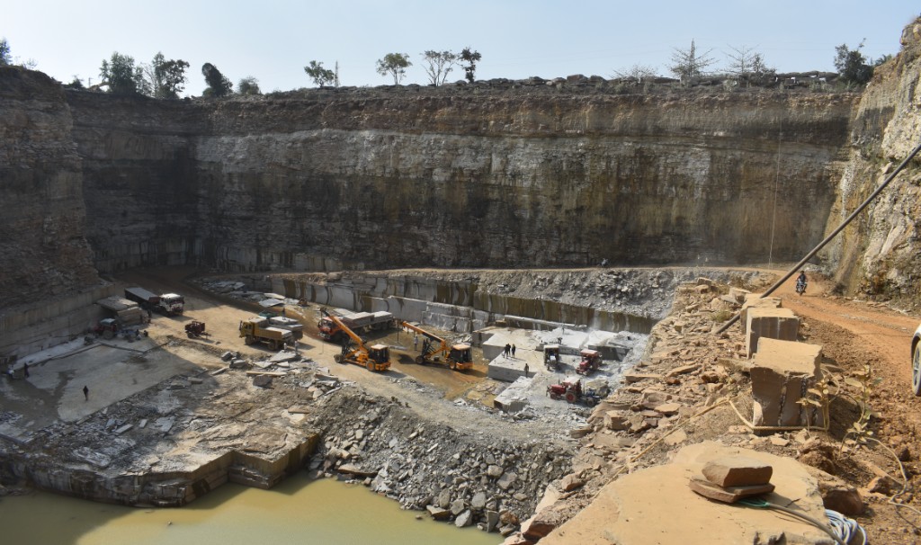 Quarry with machinery and water