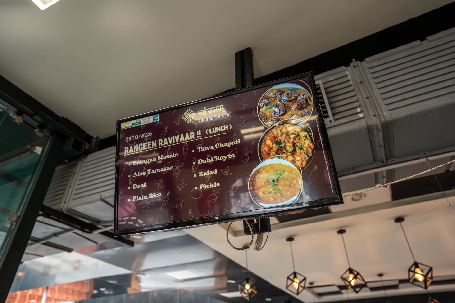 Digital menu screen showing the day's meal at Vyanjanam