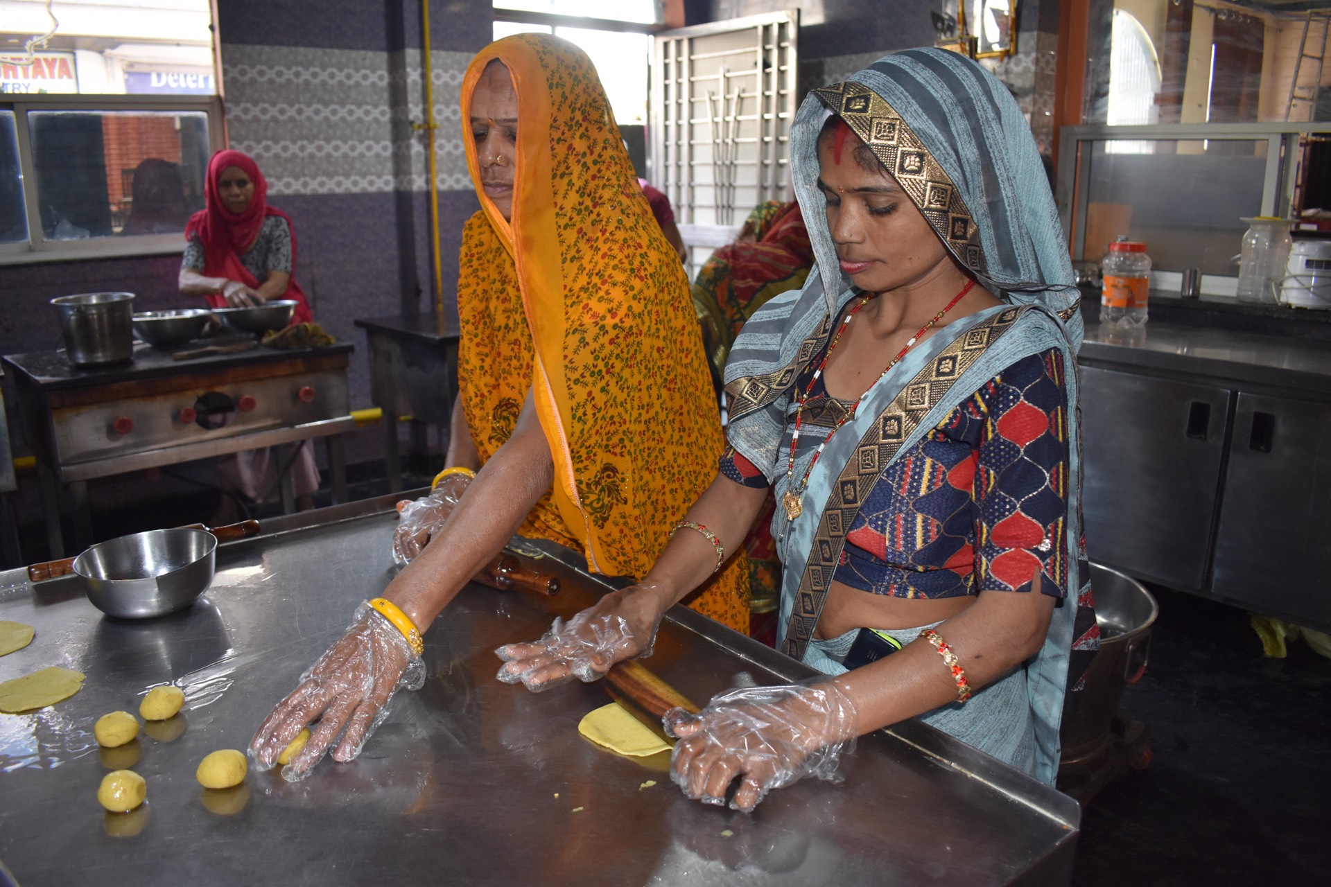 Women preparing dough in the Vyanjanam kitchen