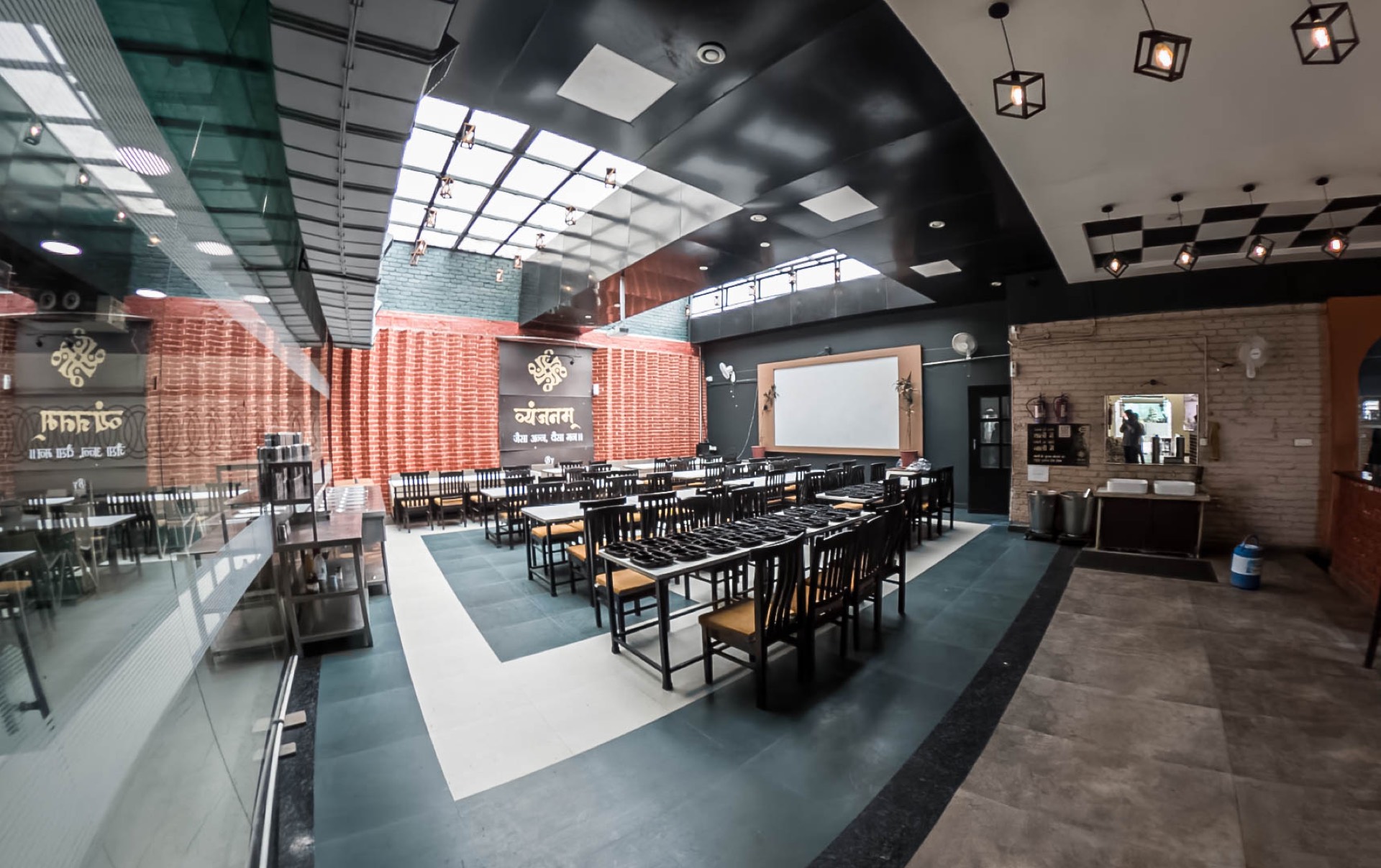 Wide dining hall setup at Vyanjanam